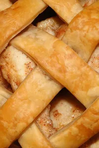 Apple pie recipe two women looking cookbook